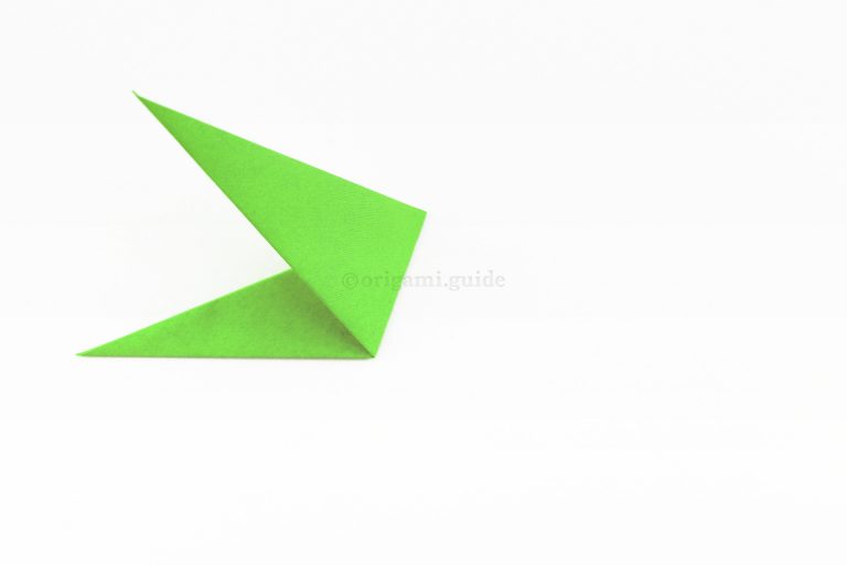 9. Fold the right of the shape up and to the left at an angle, it will be guided by inner flaps inside.