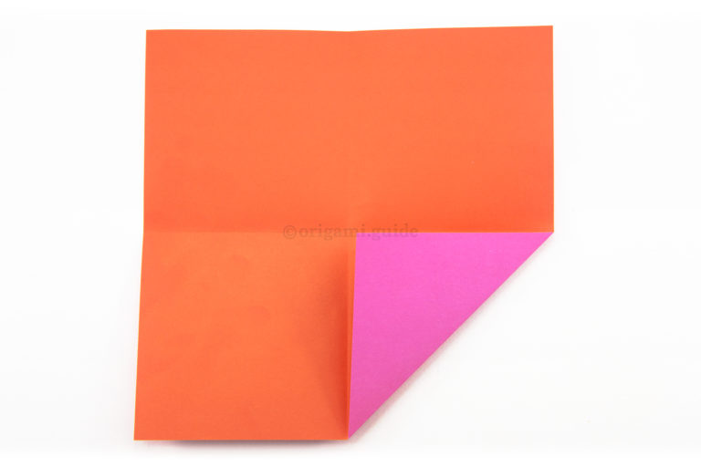 6. Fold the bottom right corner to the middle of the paper.