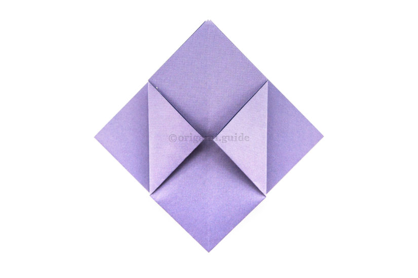 17. Fold the left and right points to meet the middle.