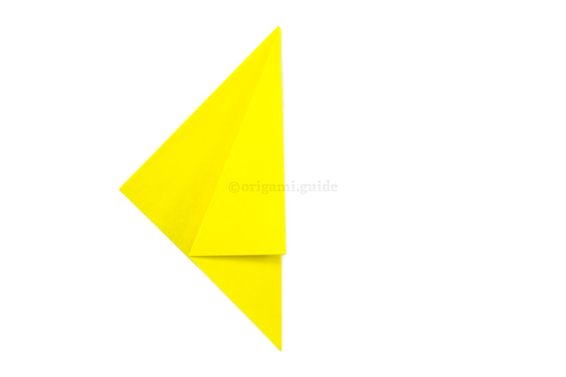 3. Fold the point back over to the right, aligning the diagonal edge to the right edge.