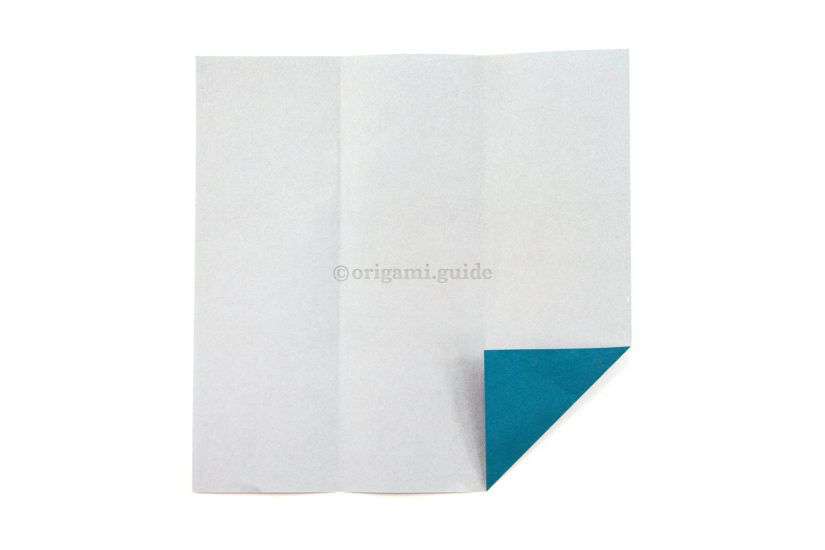 10. Next, fold the bottom right corner diagonally, aligning with the right vertical crease.