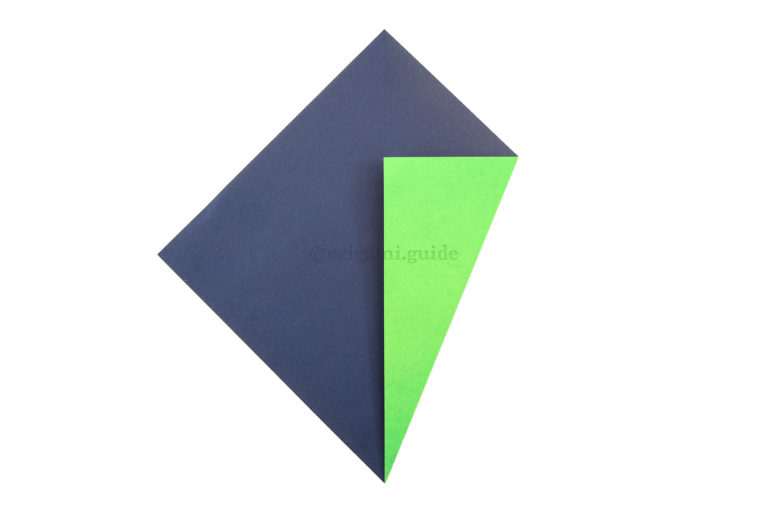 5. Take the bottom right diagonal edge and fold it to align with the central vertical crease.