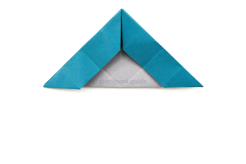 23. Fold the bottom point up the top point.