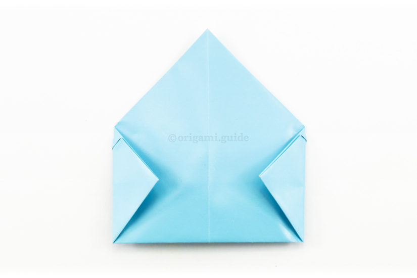 14. Fold the left point to the right, 13. Fold the right, using the vertical edge of the flap you previously folded.