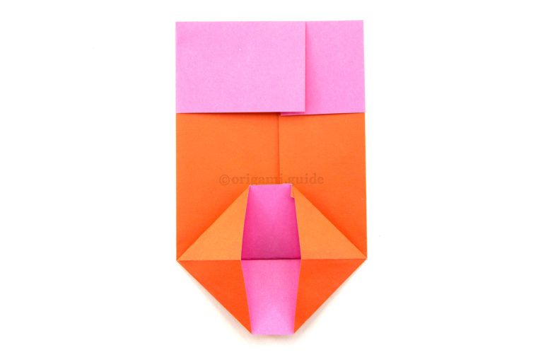 11. Open out the bottom section, squash folding the two sides into triangles.
