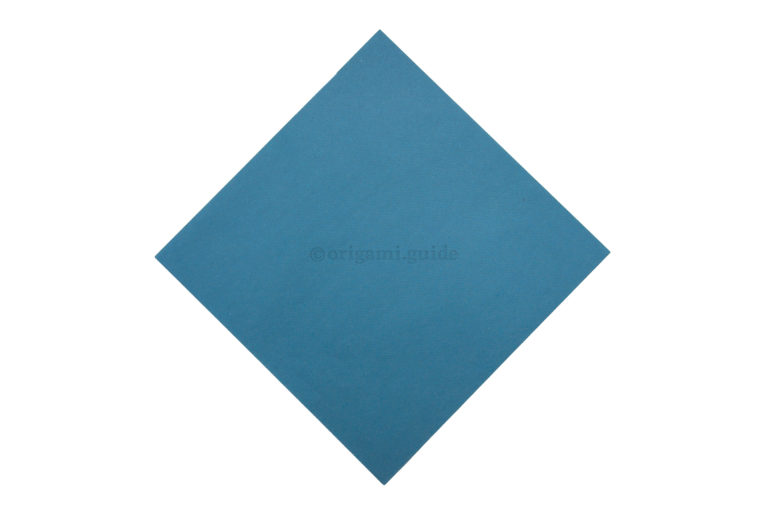 2. Flip the paper over to the back, origami paper is usually white on this side.