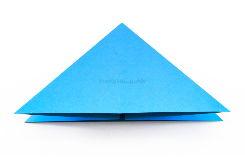 13. Flatten the paper into a triangle, this is now an origami water bomb base.