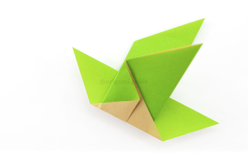 11. Now you can create a beak shape for the origami bird.