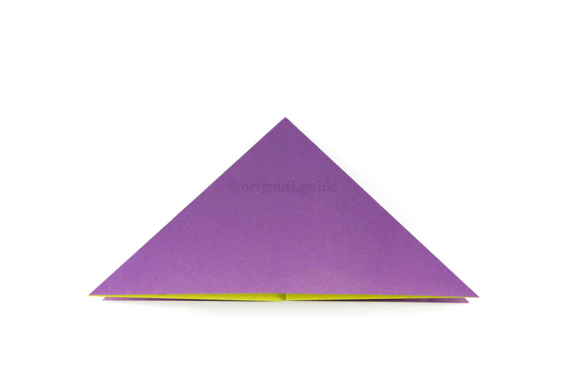 12. Flatten the paper to form a triangle. (This is a water bomb base)