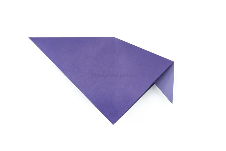 6. Push the corner "inside" and flatten the paper. The inside reverse fold is complete.