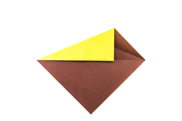 6. Repeat the same fold on the top left diagonal edge.