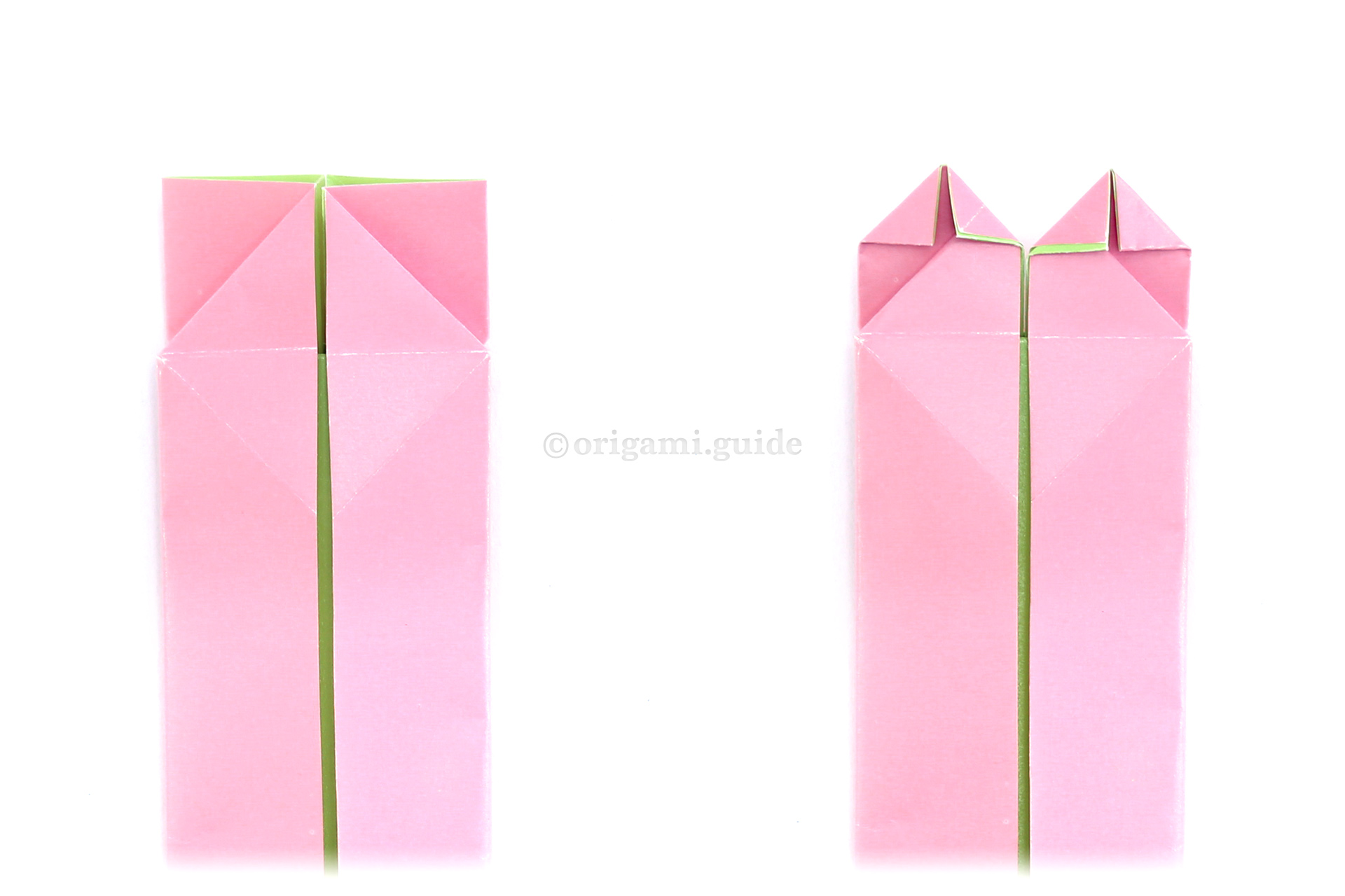Flip the model back over to the other side. Next, shape the top of the heart by folding the top points diagonally down.