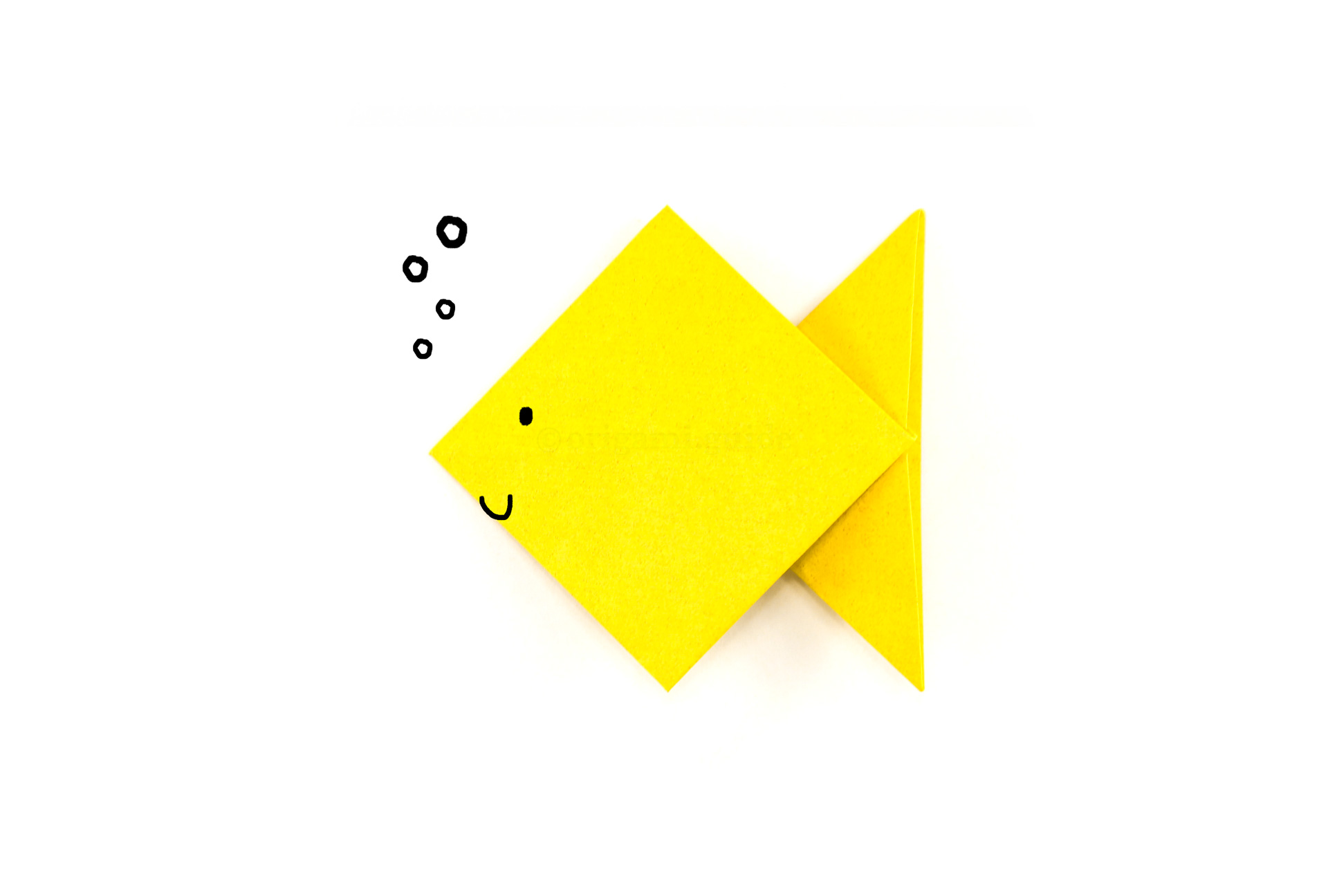 You can draw a face, fins or scales, or maybe even colourful washi tape could be used to decorate your new origami fish friend.