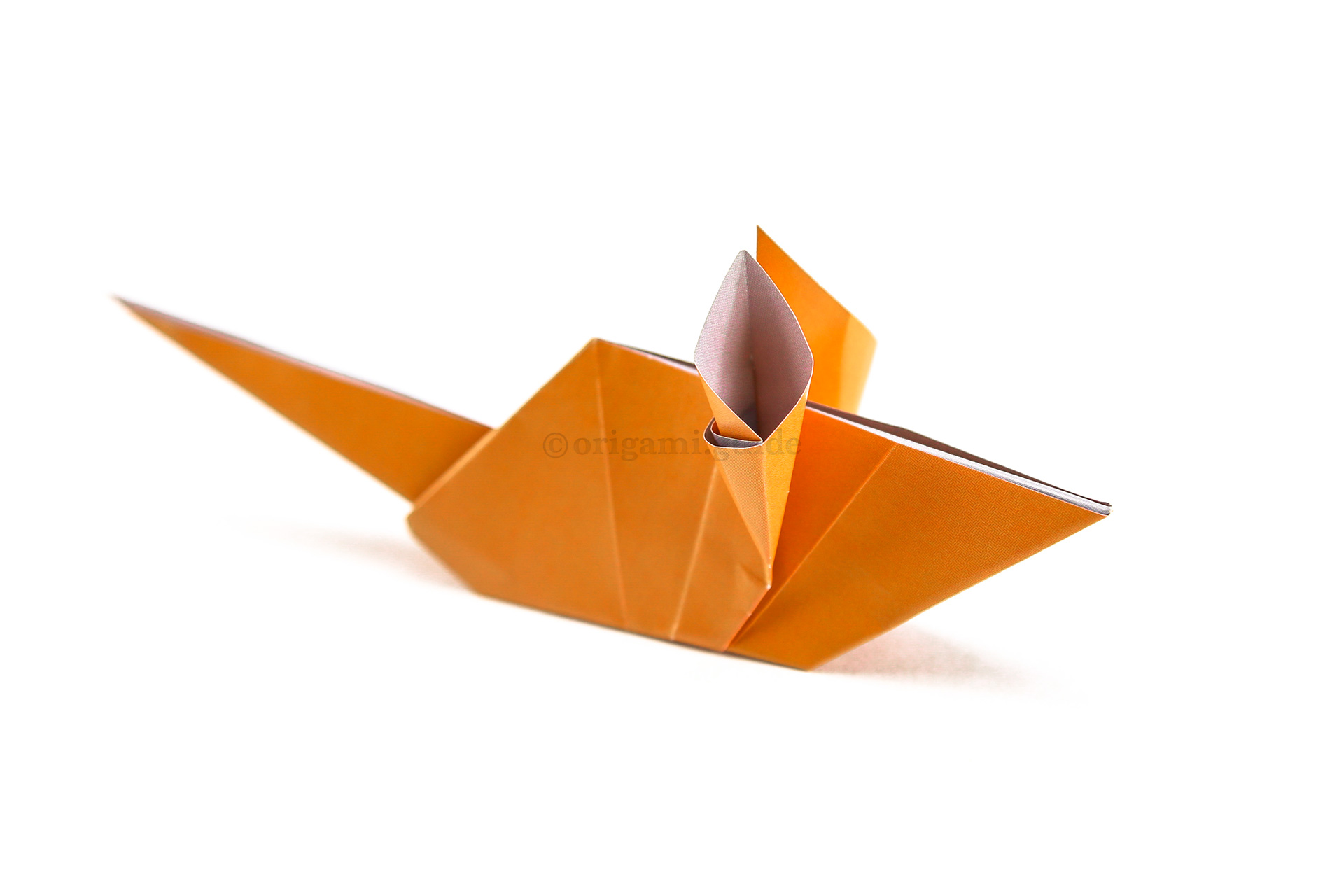 You can fold the lower section under to give your origami mouse different poses.