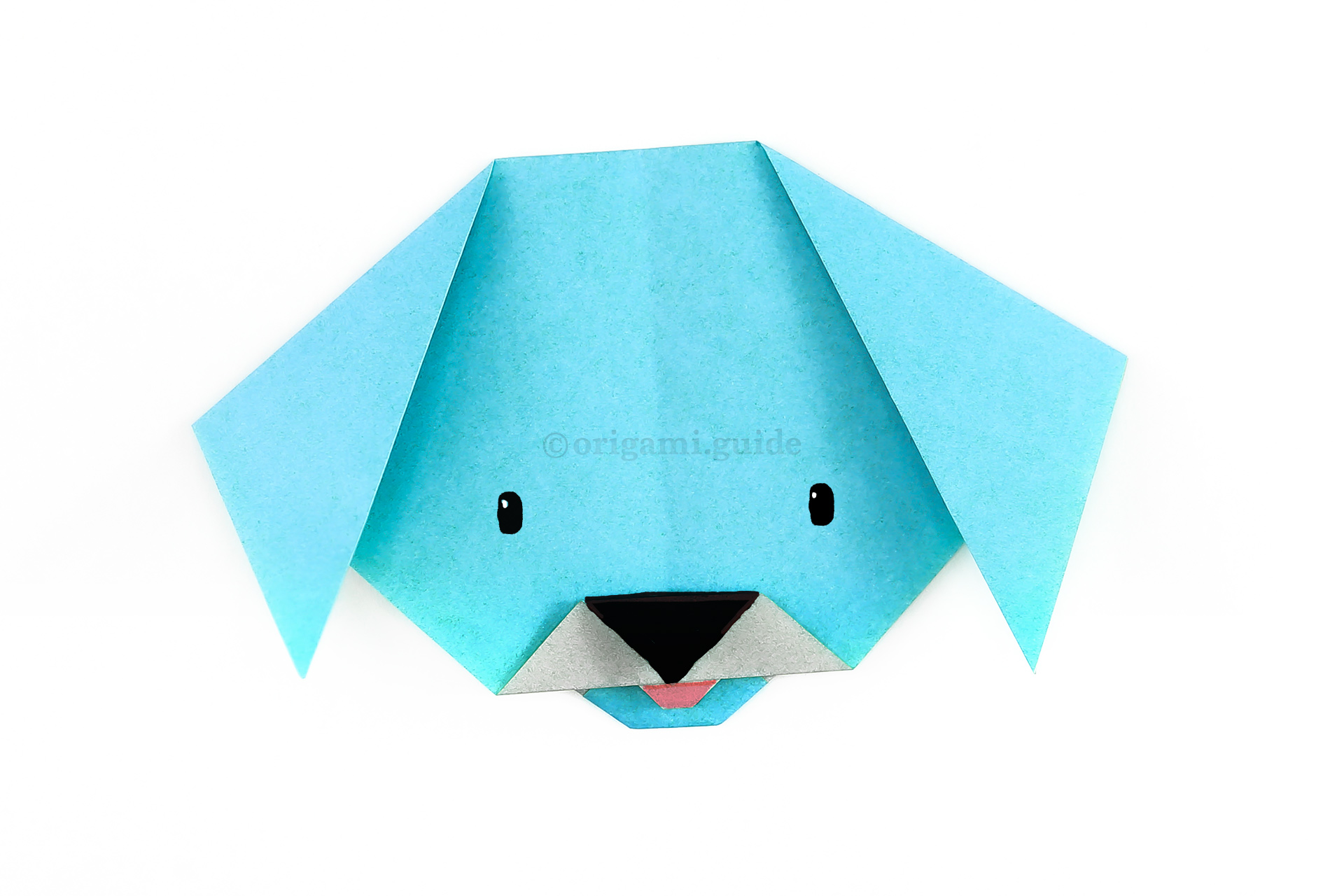 Finally, you can draw a face on your origami dog, even use some pens to colour the nose and tongue.