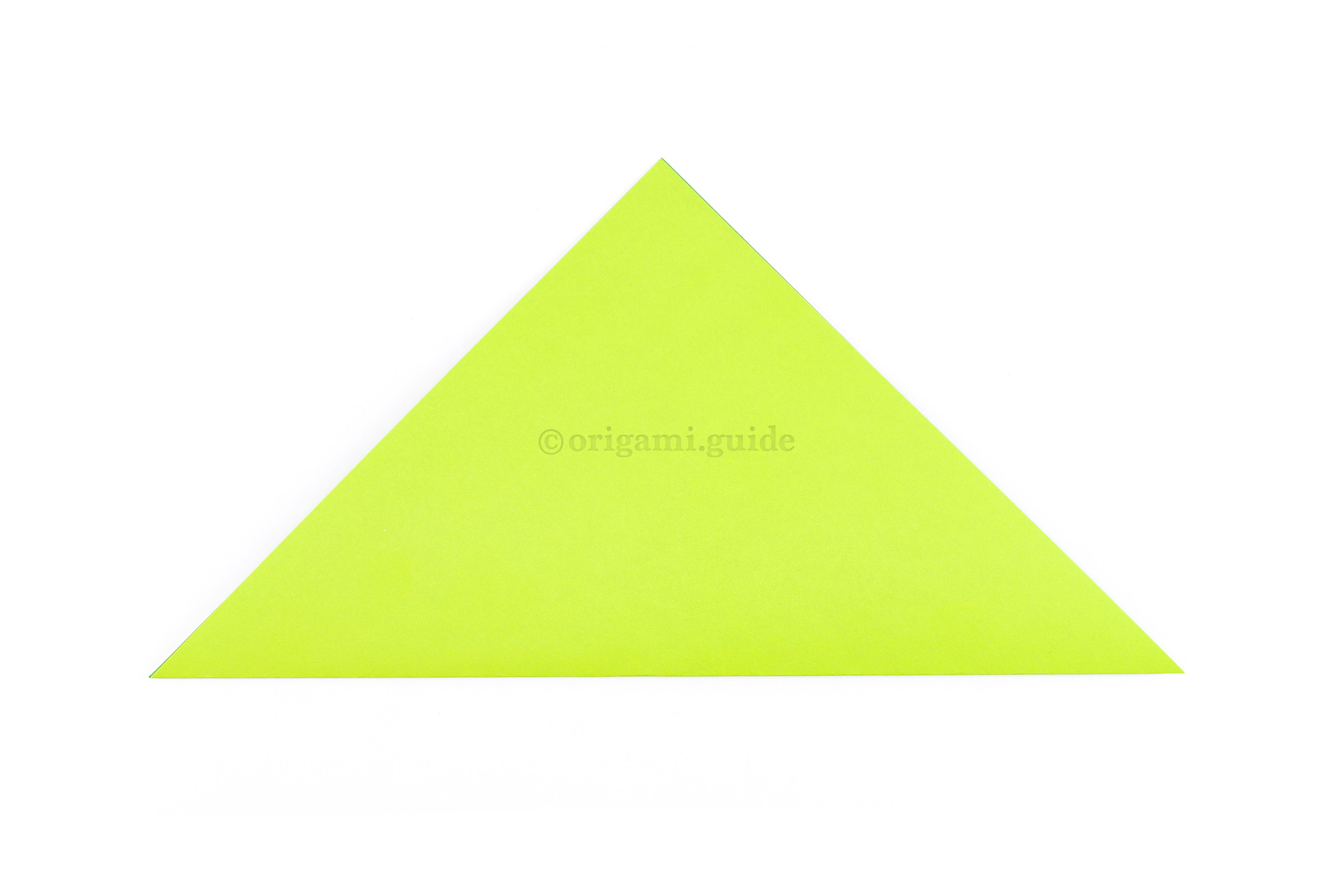 Fold the paper diagonally in half so that you have a triangle shape.