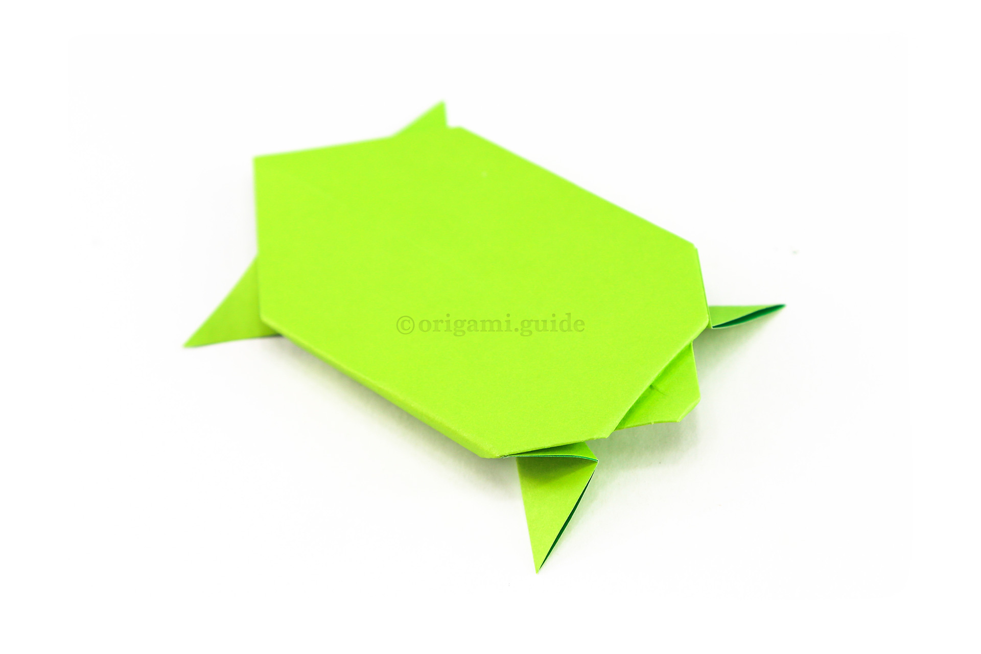 Flip the origami turtle over to the other side and adjust the legs however you like. You could draw a little face on the turtle as well.