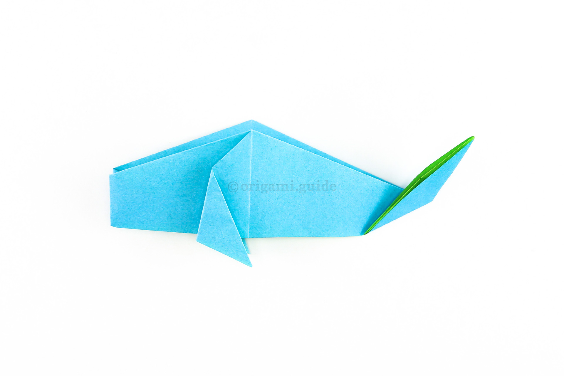To shape the tail, fold it up at an angle as shown.
