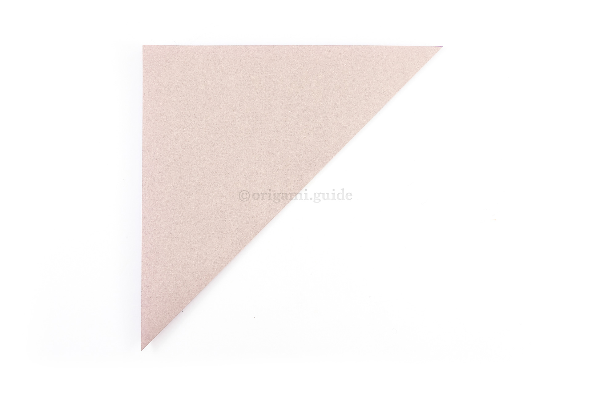 We will fold a square base to start. Fold the bottom right point of the paper diagonally up to the top left corner.