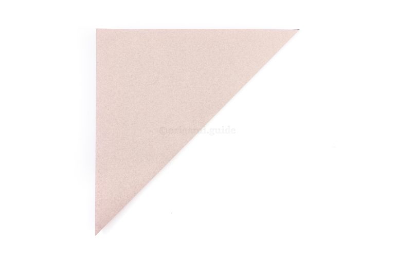 Start by making an origami square base. Skip to step 13 if you already know how. Fold the bottom right point diagonally up to the top left point.