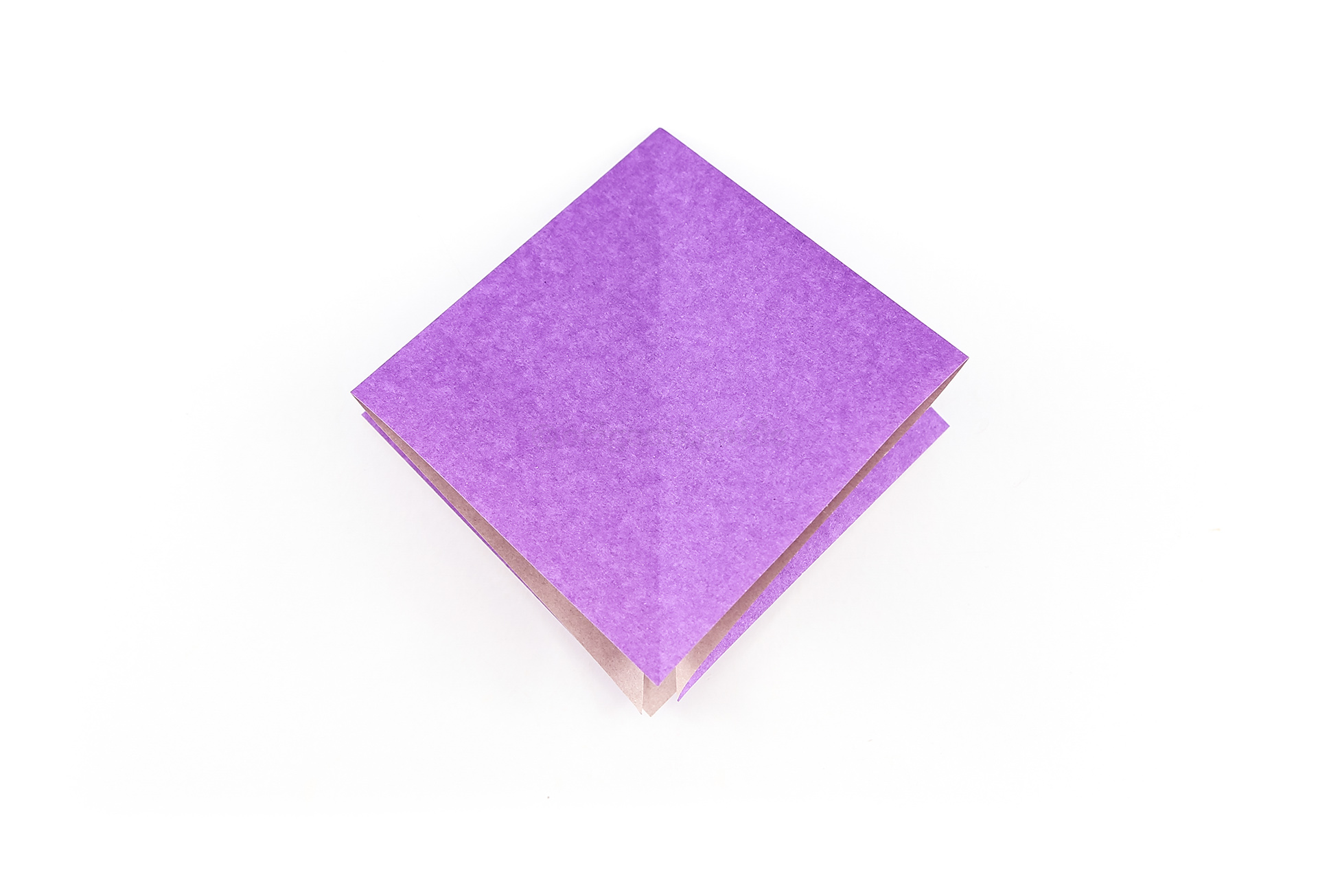 This is the completed origami square base. Please see this page for a slightly easier method.