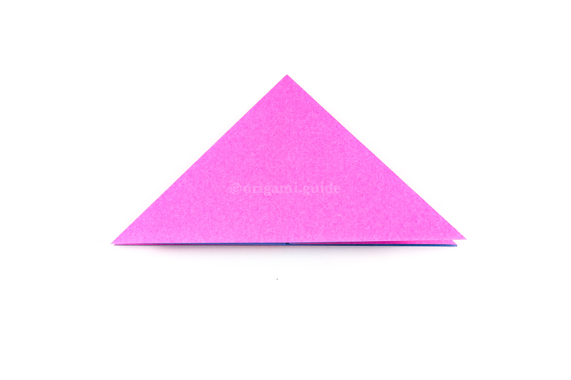 Flatten the paper into a triangle, this is the completed origami water bomb base.