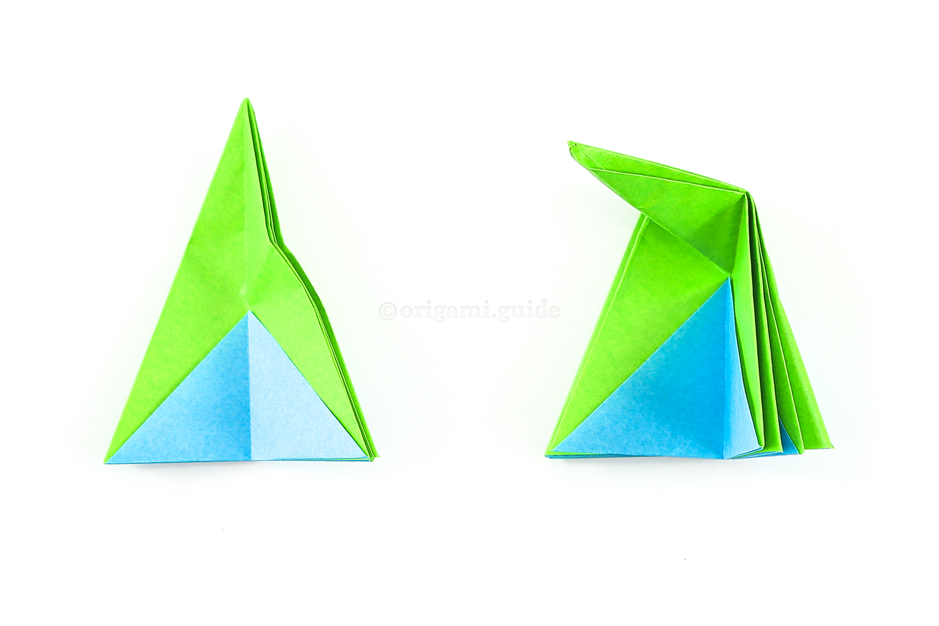 Let the previous two steps unfold. Next, reverse the crease on the top section of the triangle, and bring it down, using the previous folds as guides.