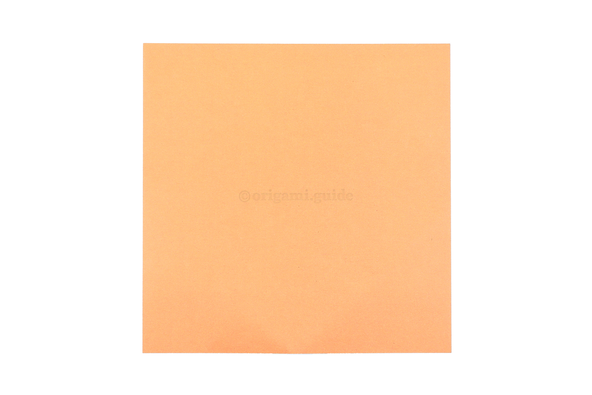 This is the back of our origami paper, this colour will become the shape of the cross.