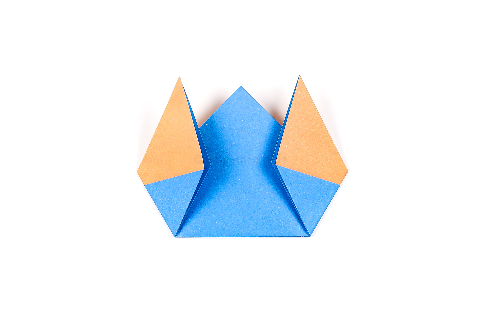 Fold both the left and right points diagonally up at an angle to resemble the shape of your broken egg.