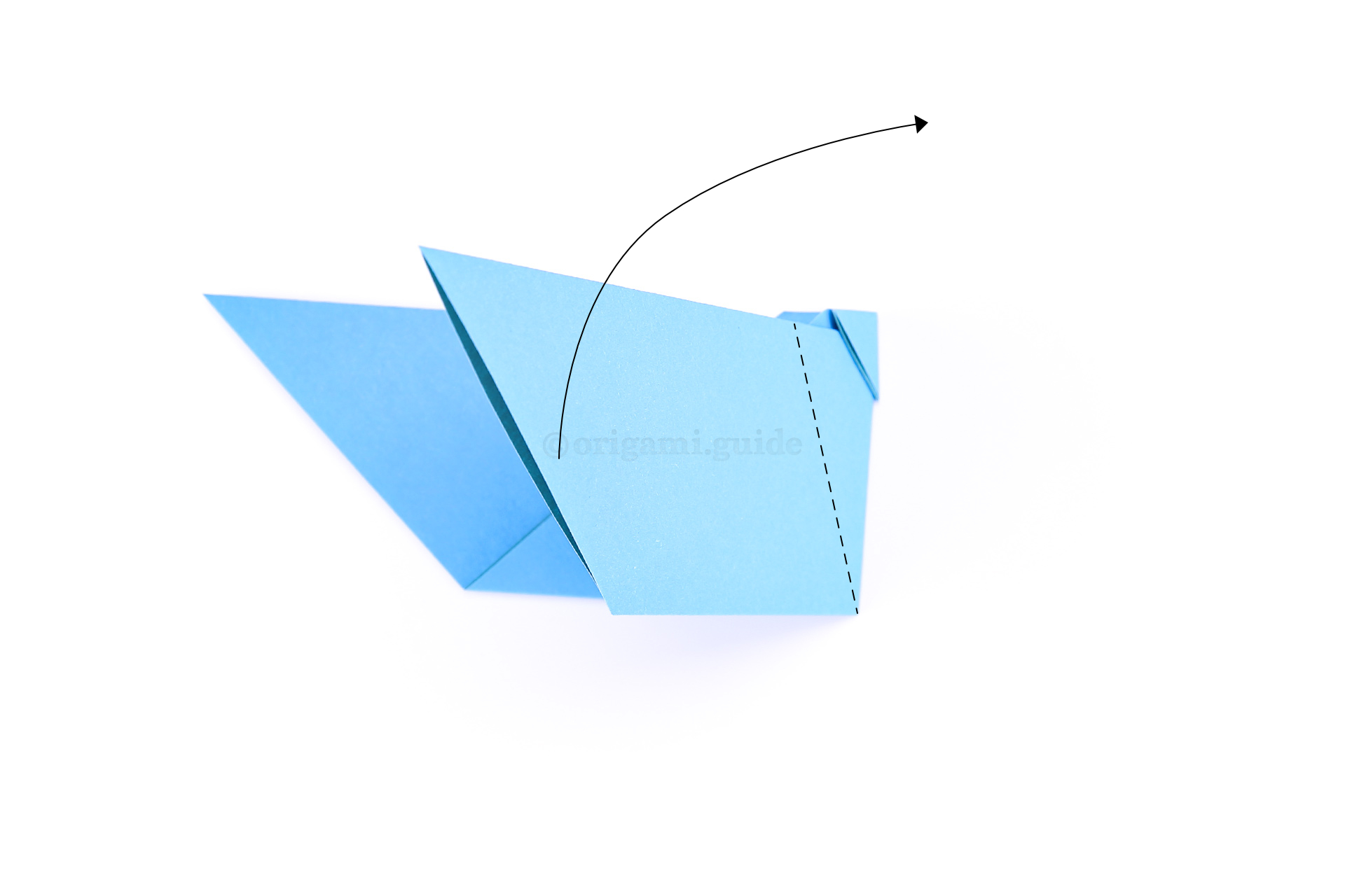 Fold the "wing" diagonally up to the right.