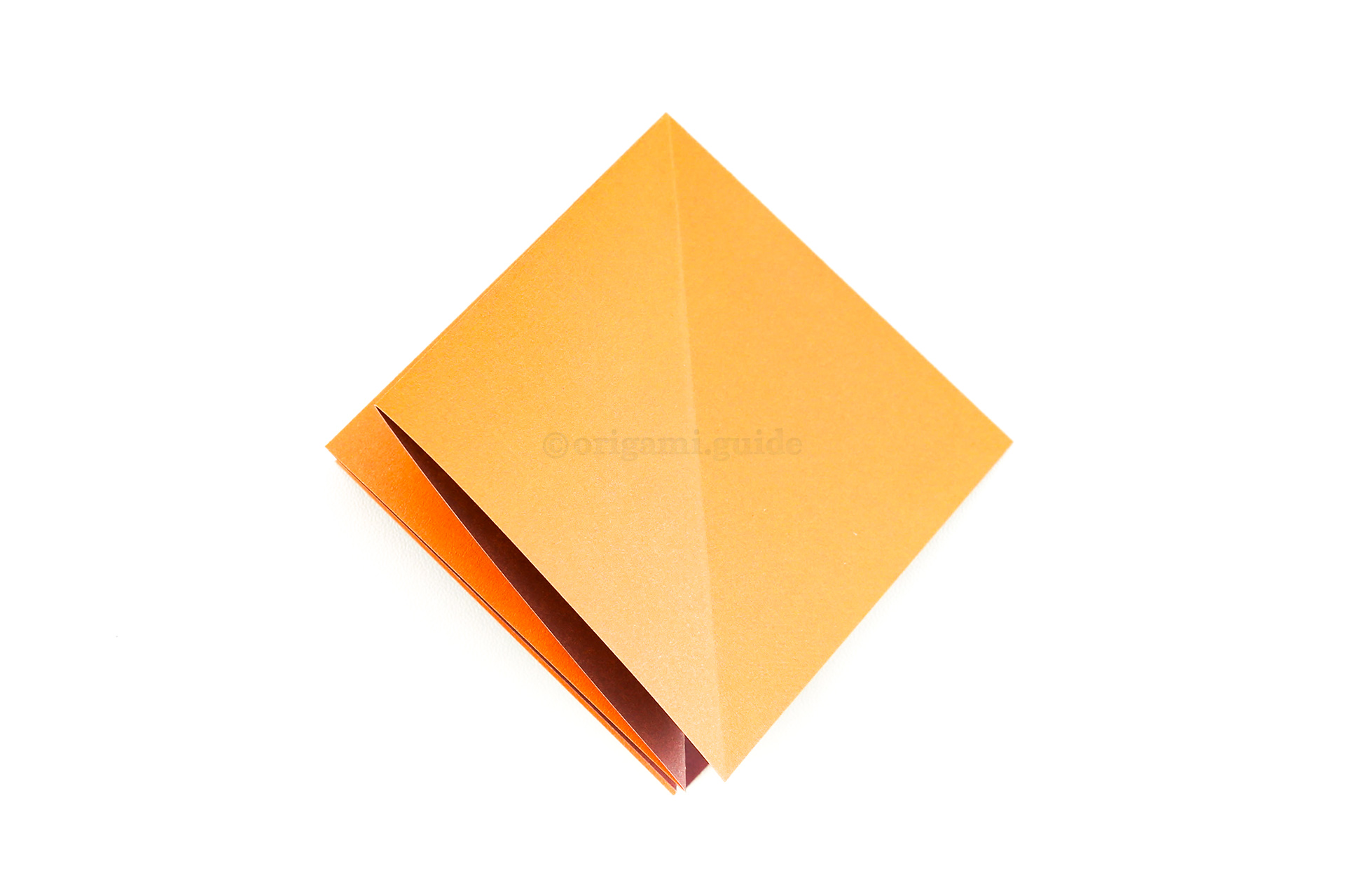 Fold the front right flap over to the left, so that there will only be one layer on the right.