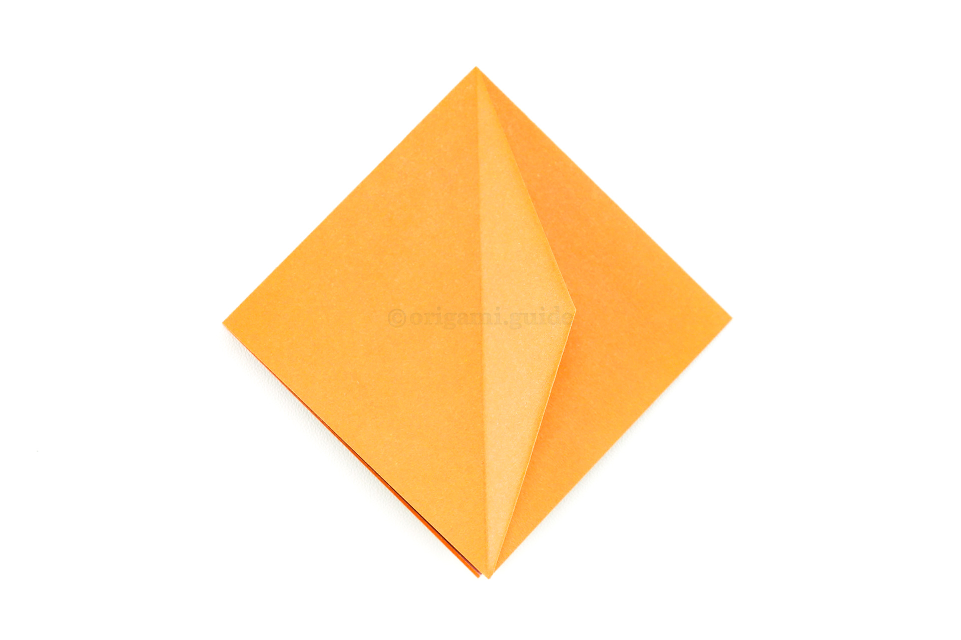 Flip the flap over to the right.