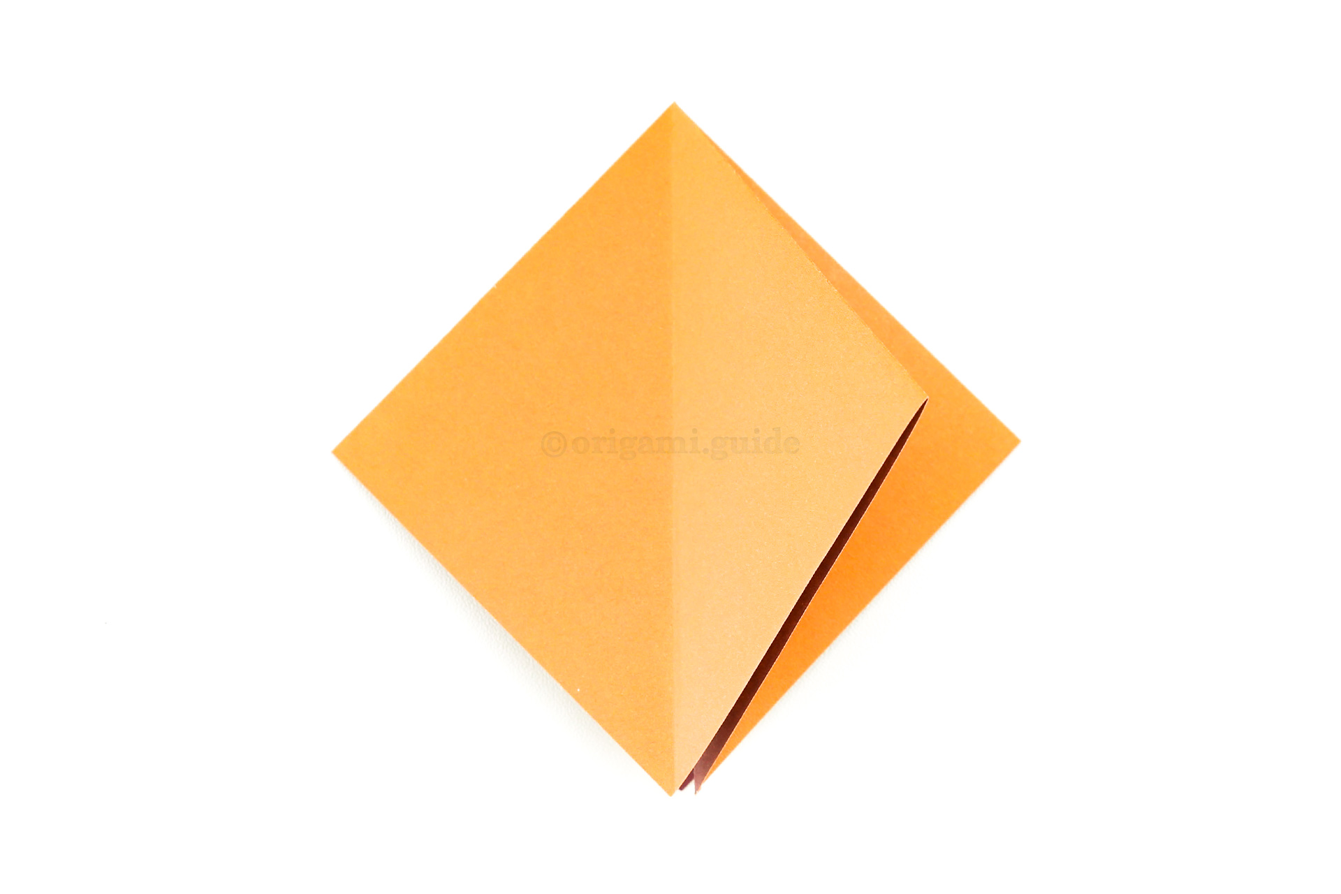Flip the left flap over to the right.