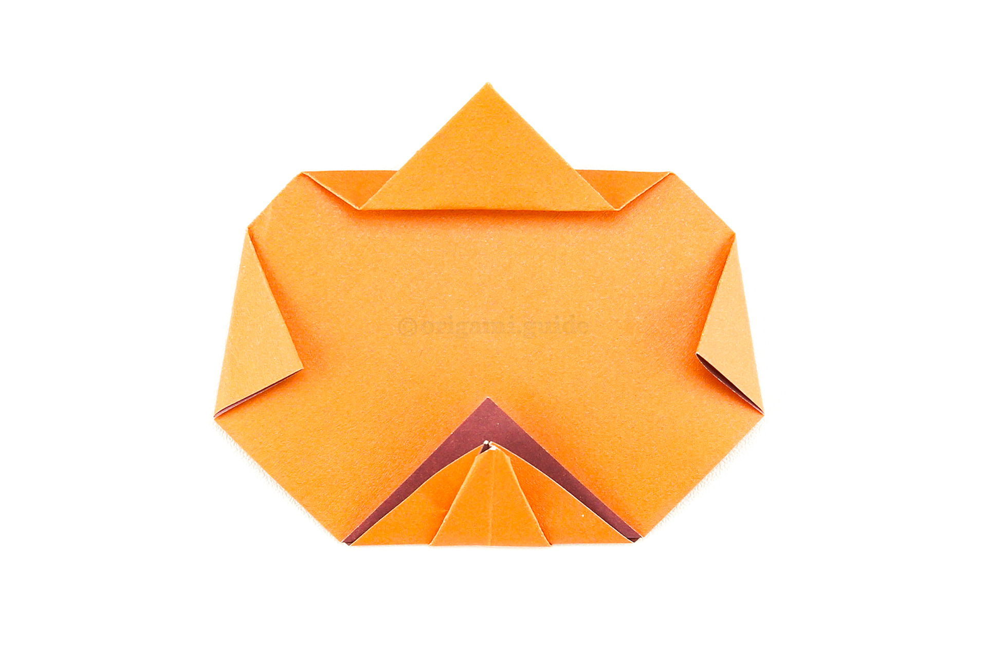 Fold the top point up, leaving a small gap to form a pumpkin stalk.