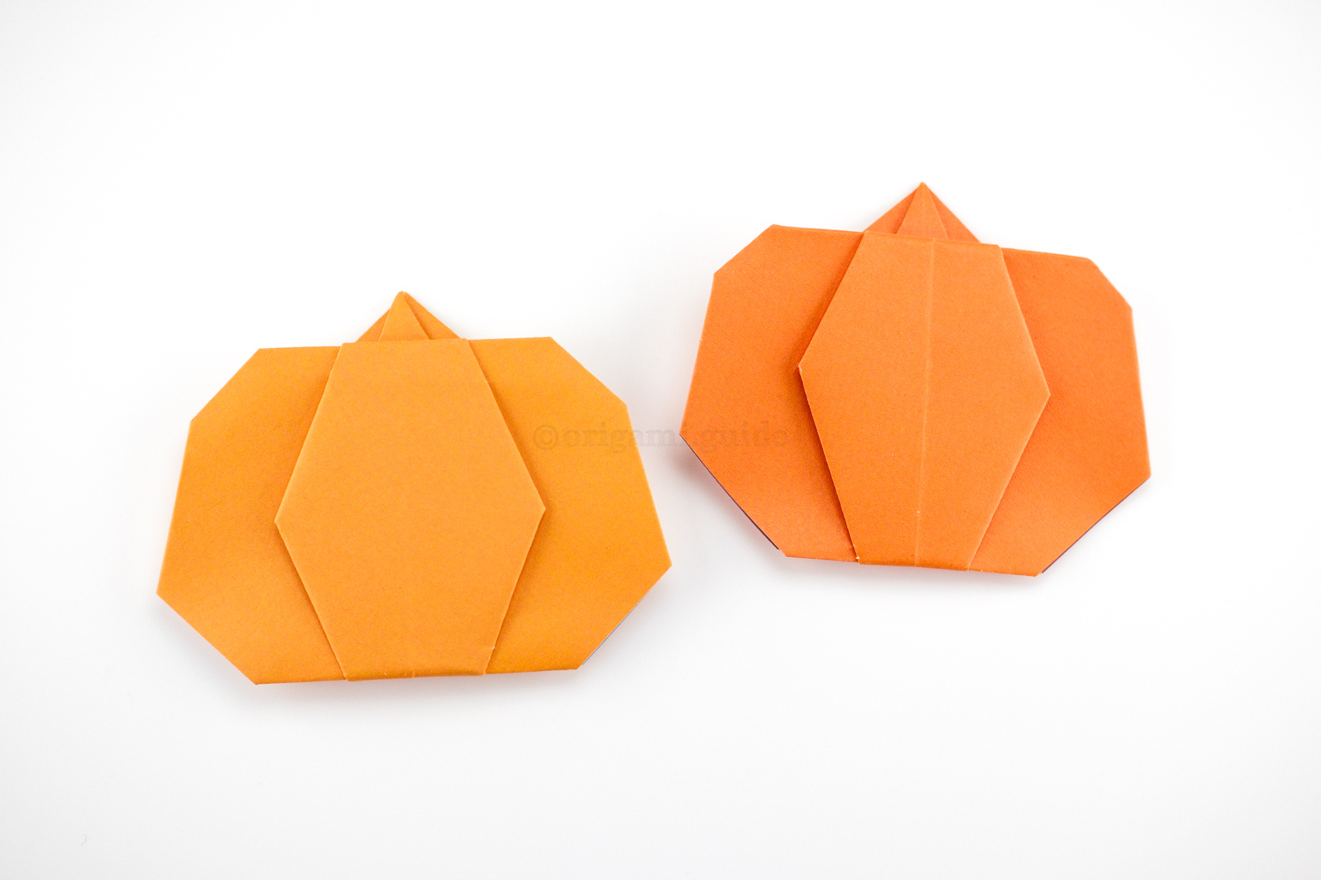 The origami pumpkin is complete. You could even draw a cute face onto the pumpkin, or a scary Halloween face!