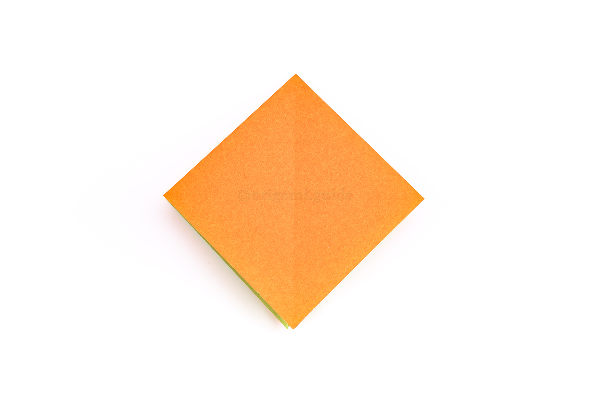 Step 14 - Flatten the paper down and this is the completed origami square base.