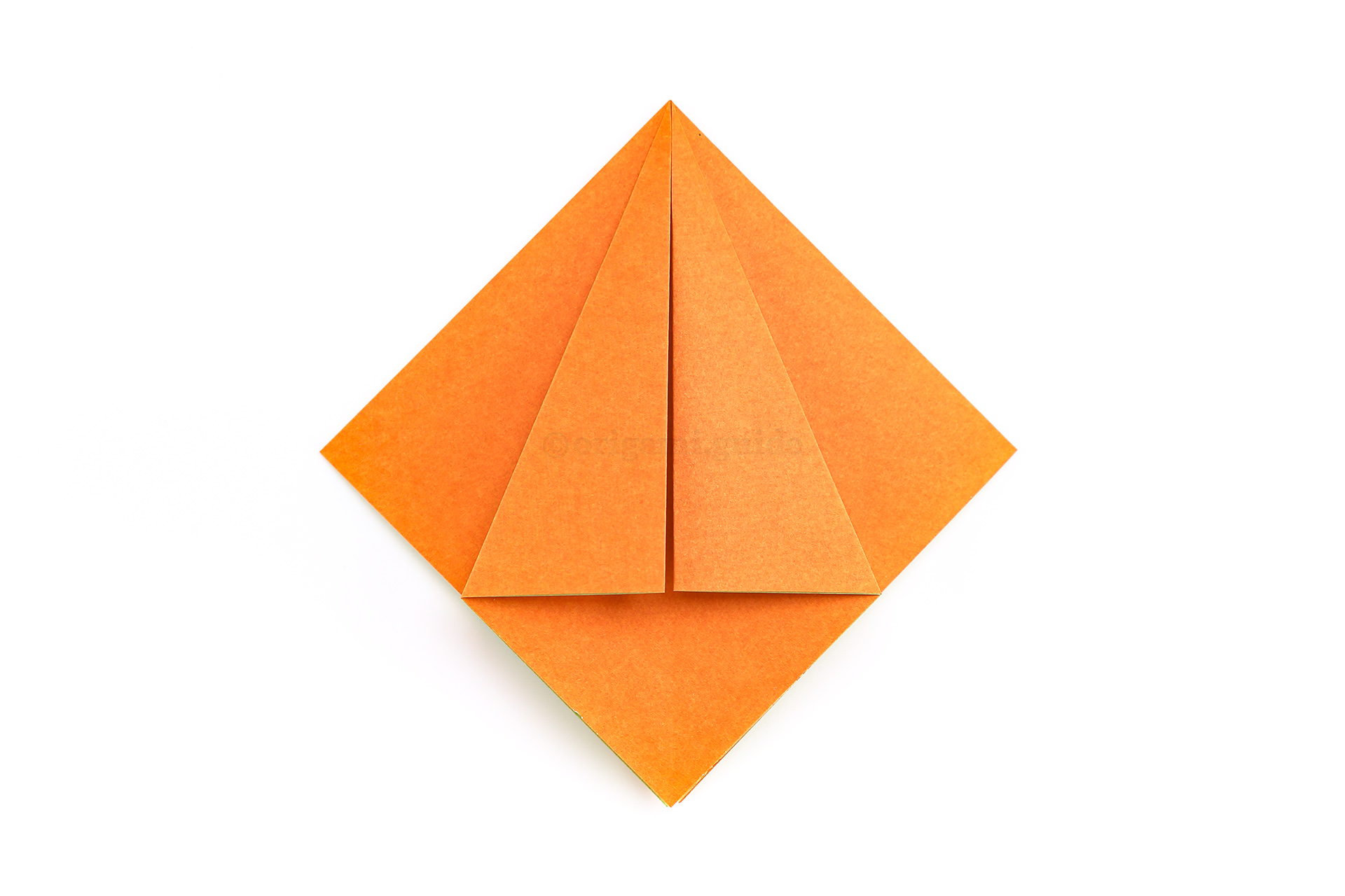 Step 16 - Fold the left point to the center crease as well.
