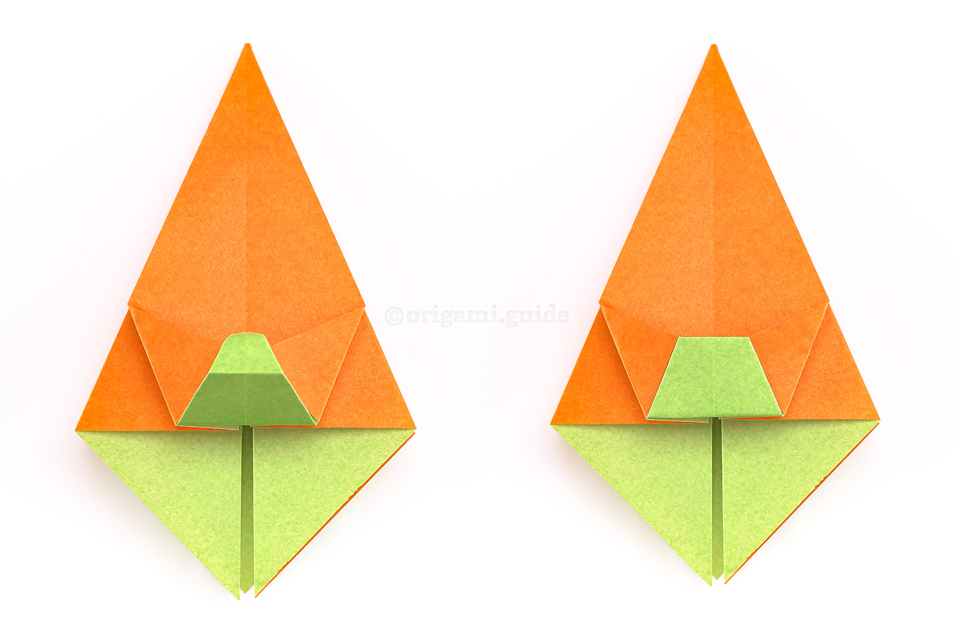Step 28 - Now, fold the pont back up and tuck the point under the triangular flaps.