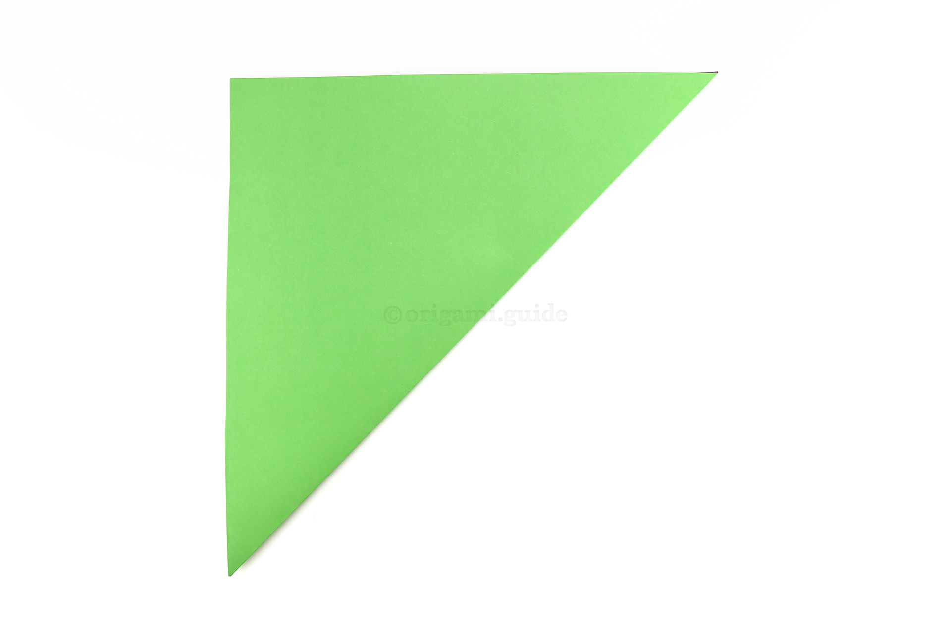Make an origami square base. First fold the bottom right corner diagonally up to the top left corner.
