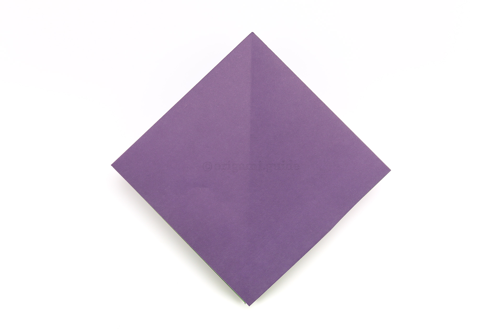 Flip the paper over to the other side, from left to right.