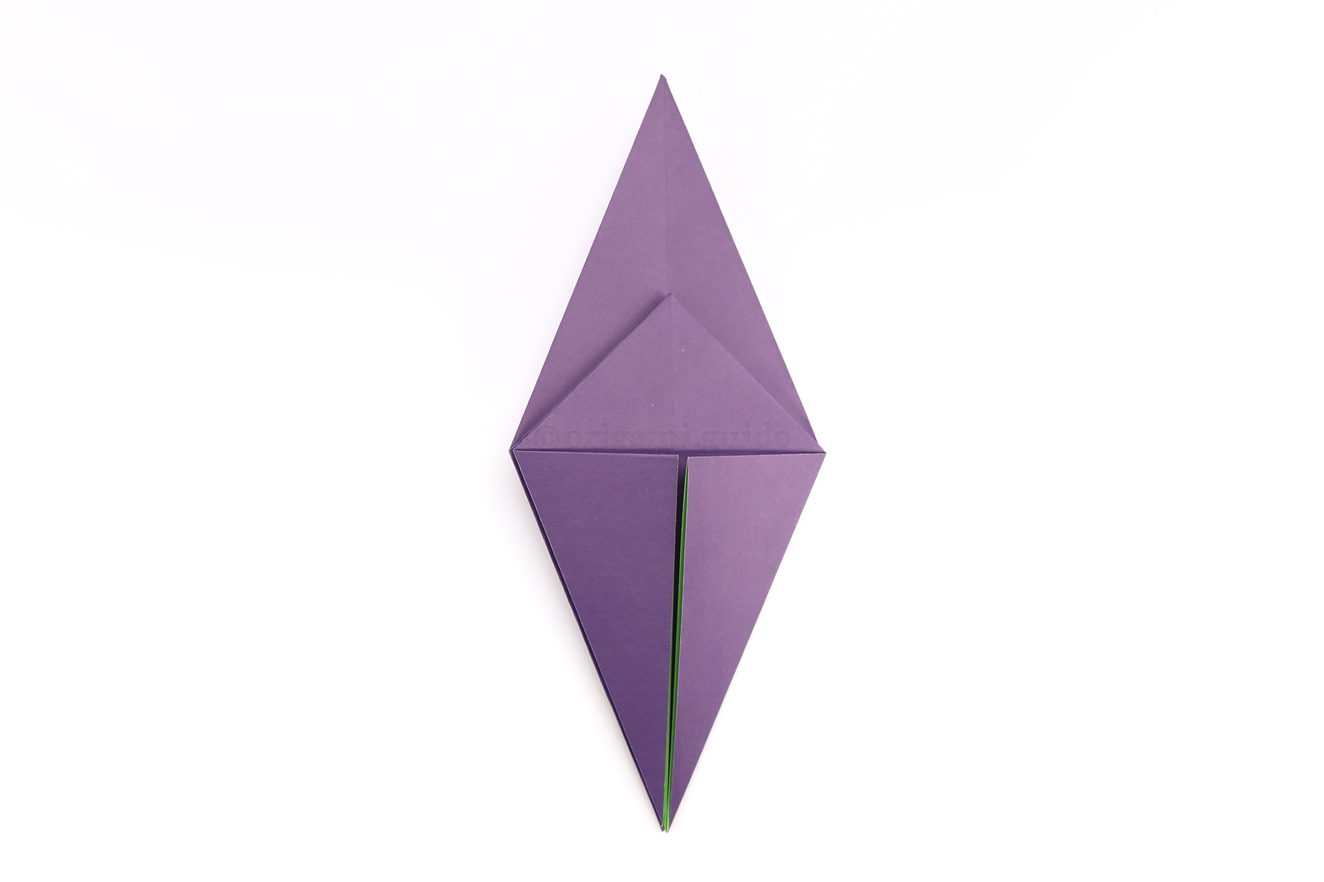 Flip the paper over to the other side, from left to right.