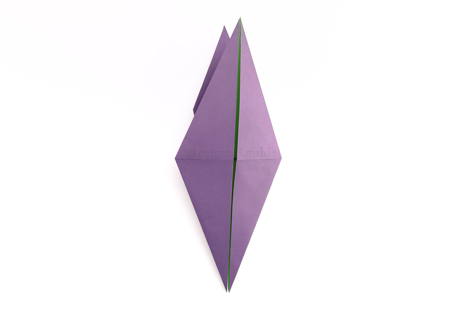 Flip the paper over to the other side, from left to right.