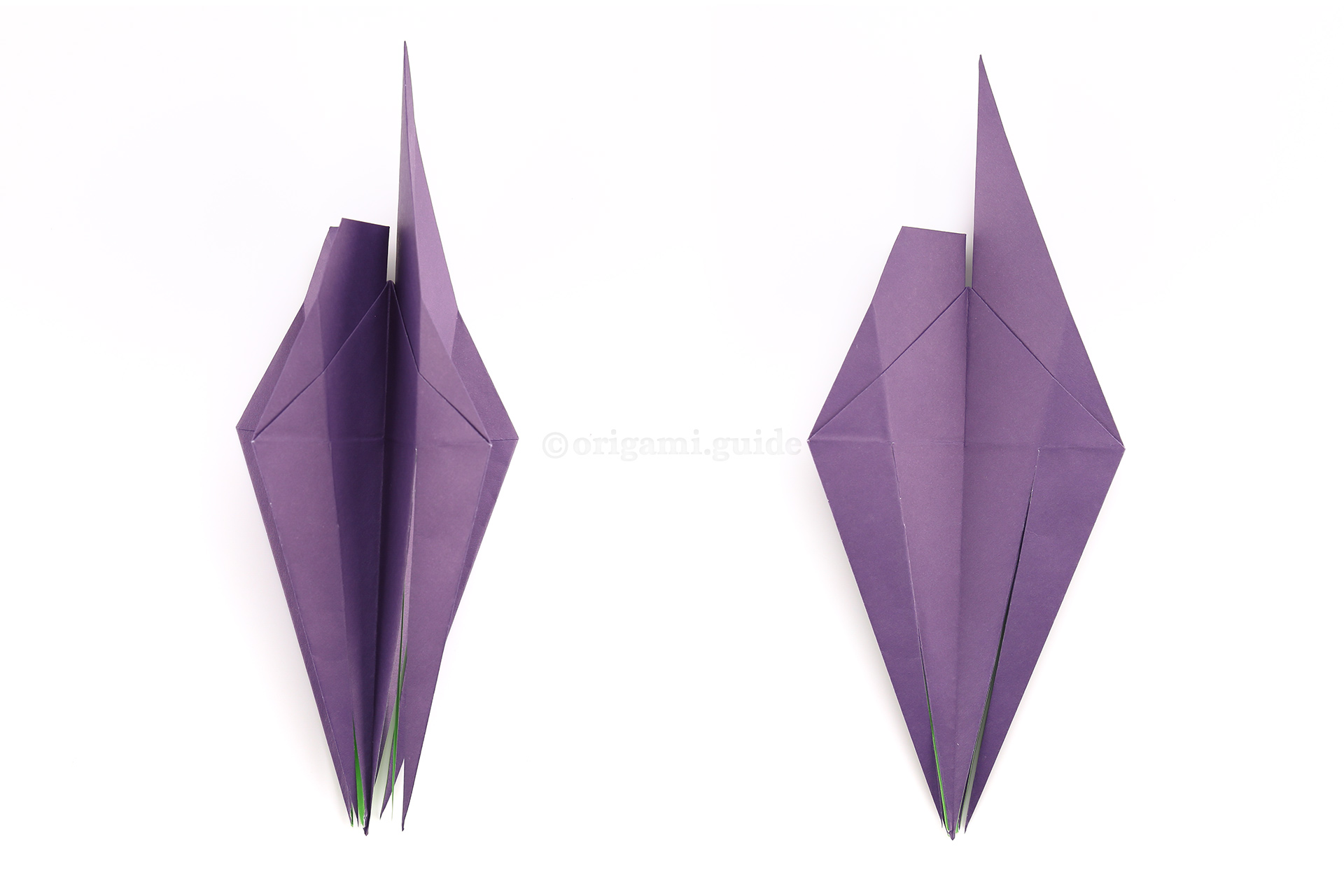 Flip the flaps around, like flipping the pages of a book, so that you're working on the alternate "faces" of the flaps. Please check the top points of the model in the photo to help make sure you have your paper in the correct configuration.