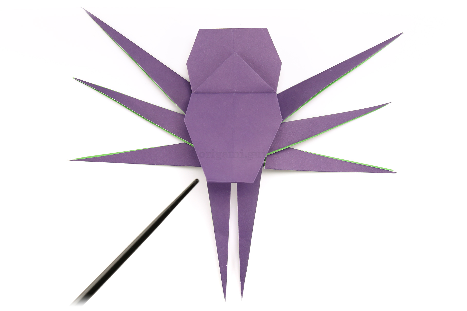 Fold the "head" of our origami spider under.