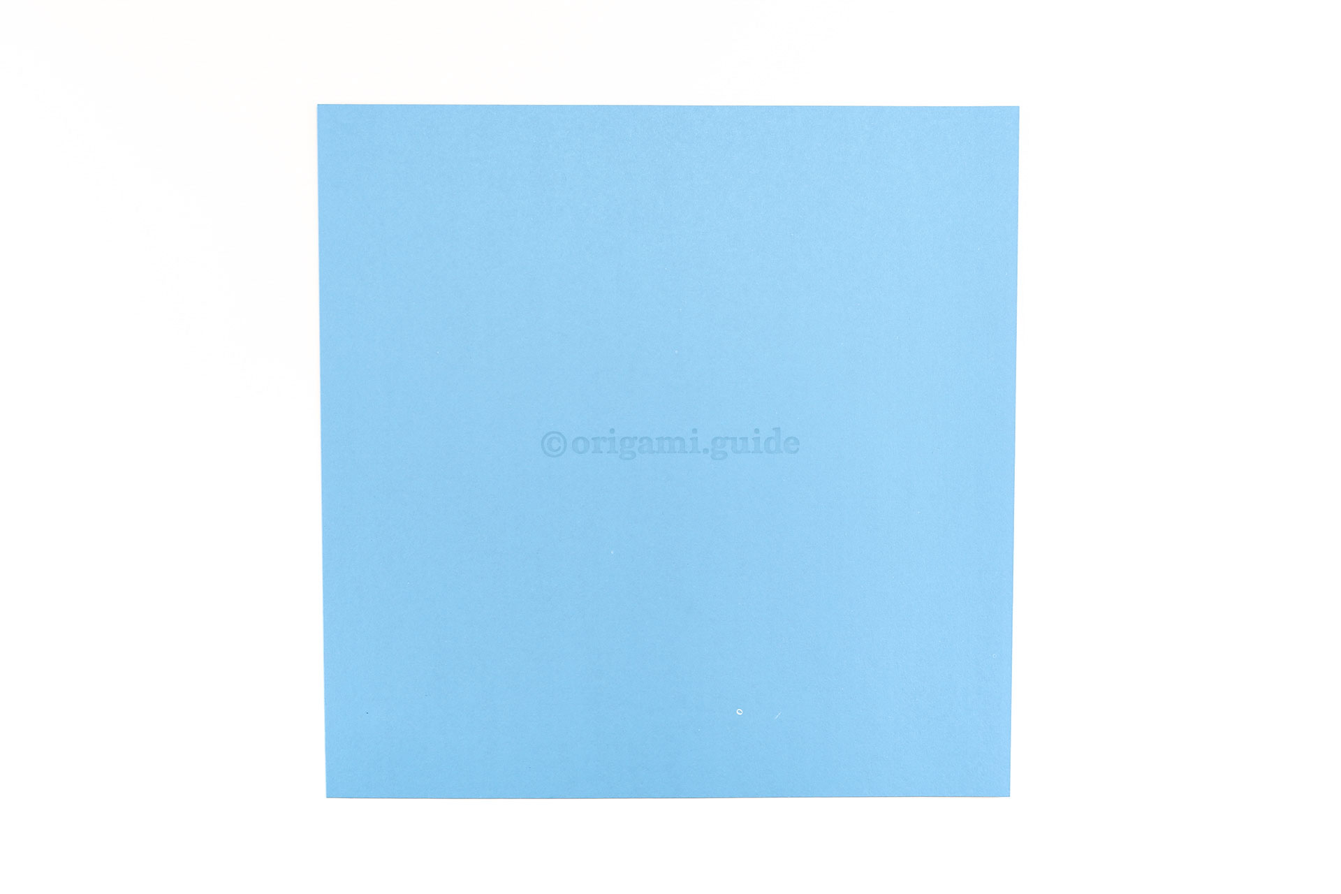 Step 2 - This is the back of the origami paper, which is often white if you're using store bought origami paper, start this side up.