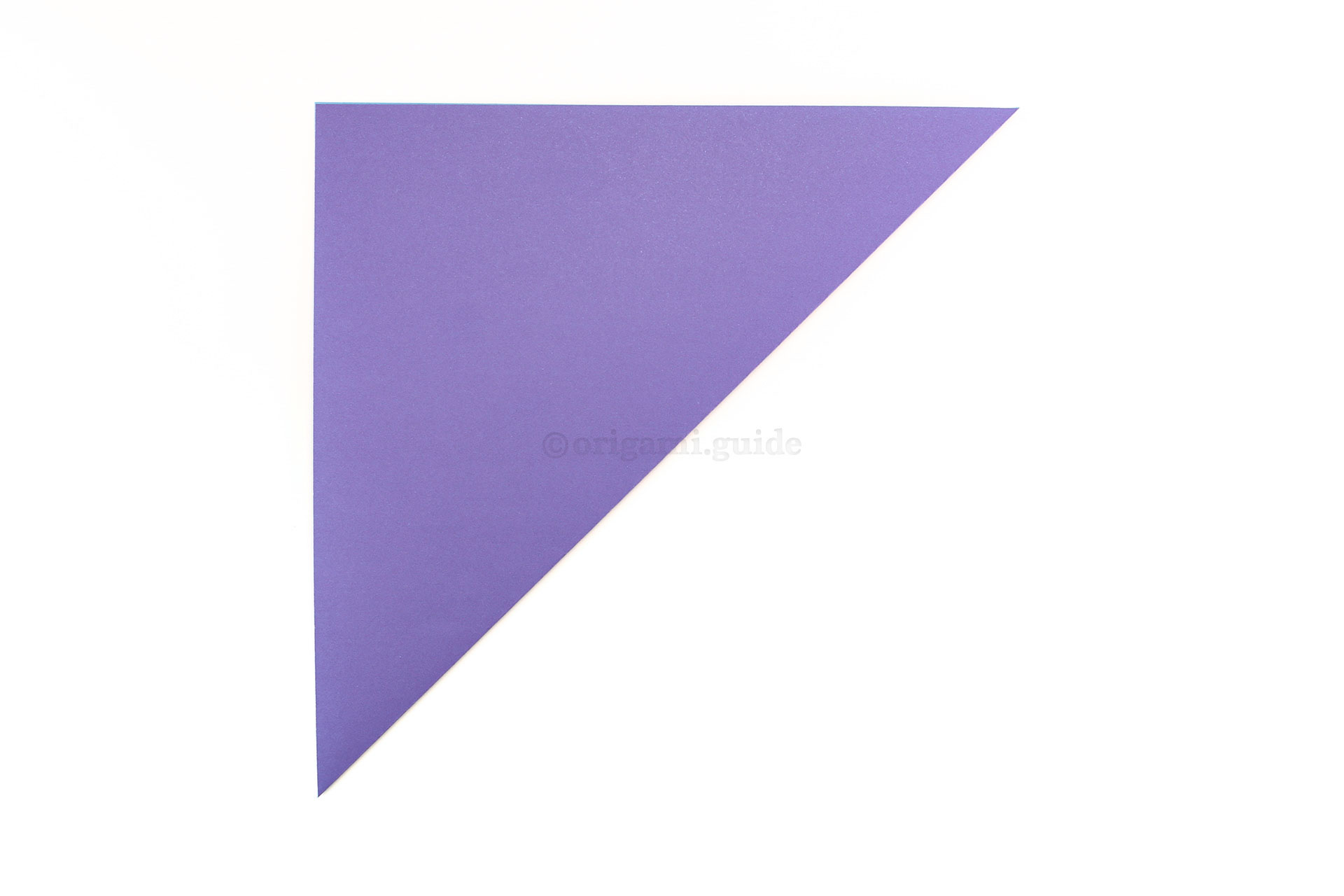 Step 3 - Start by folding the bottom right corner up to the top left corner.