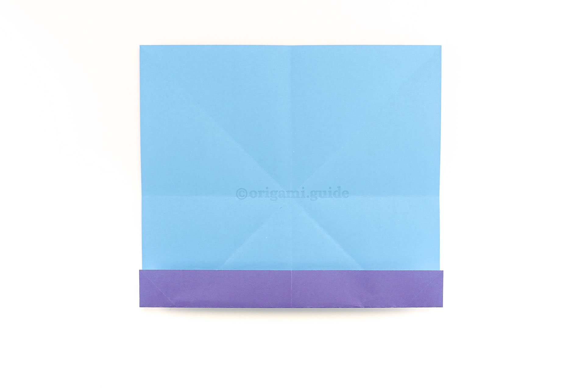 Step 13 - Now, fold the bottom edge up to meet the crease you made in the previous step.