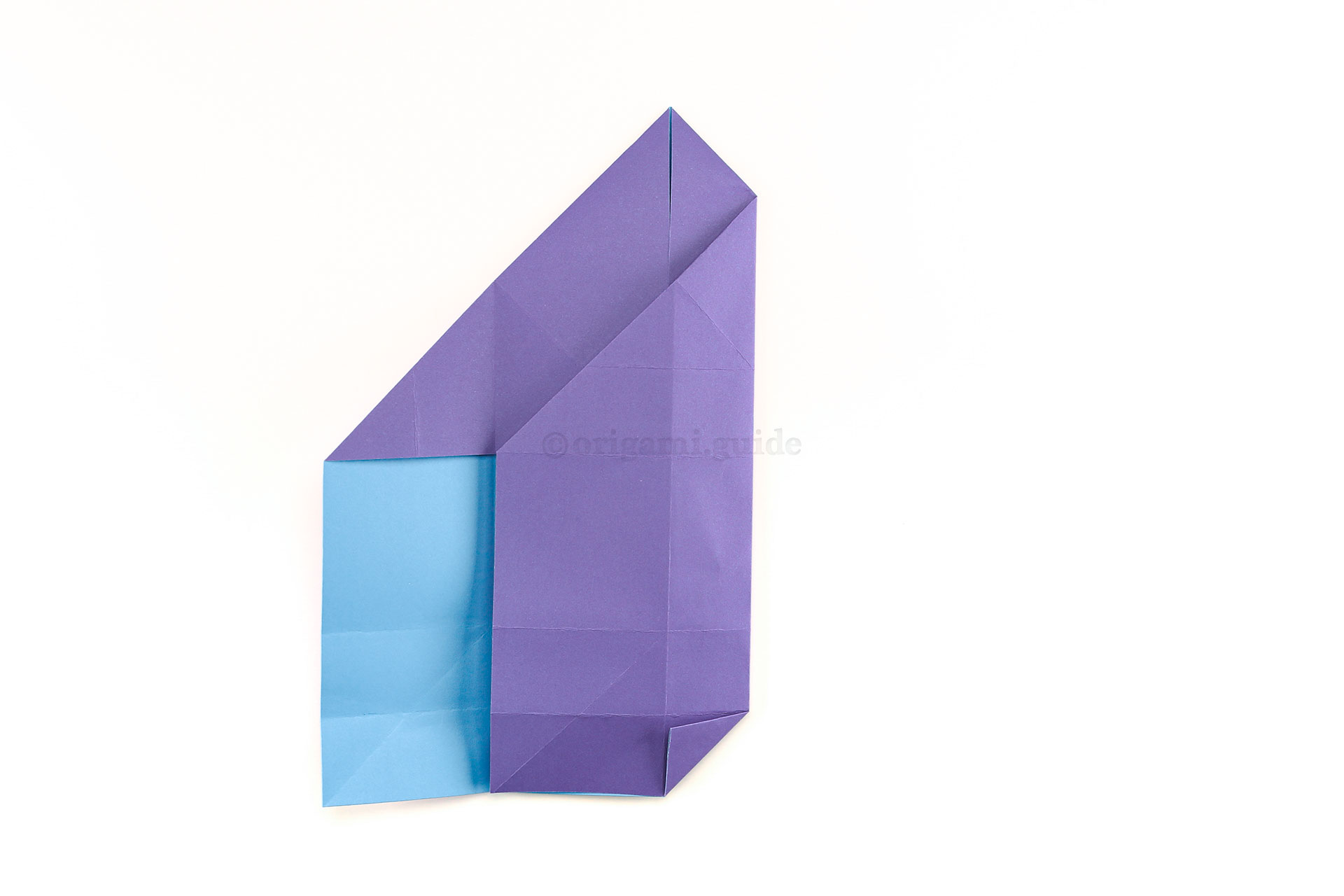 Step 19 - Next, fold the lower right corner diagonally as shown, crease well.