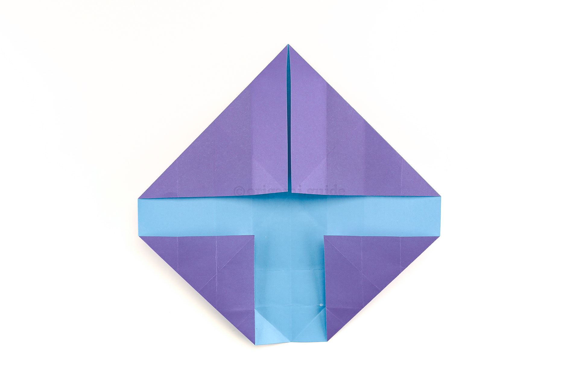 Step 23 - Unfold the last couple of steps, and then fold the lower left and right corners diagonally as shown.