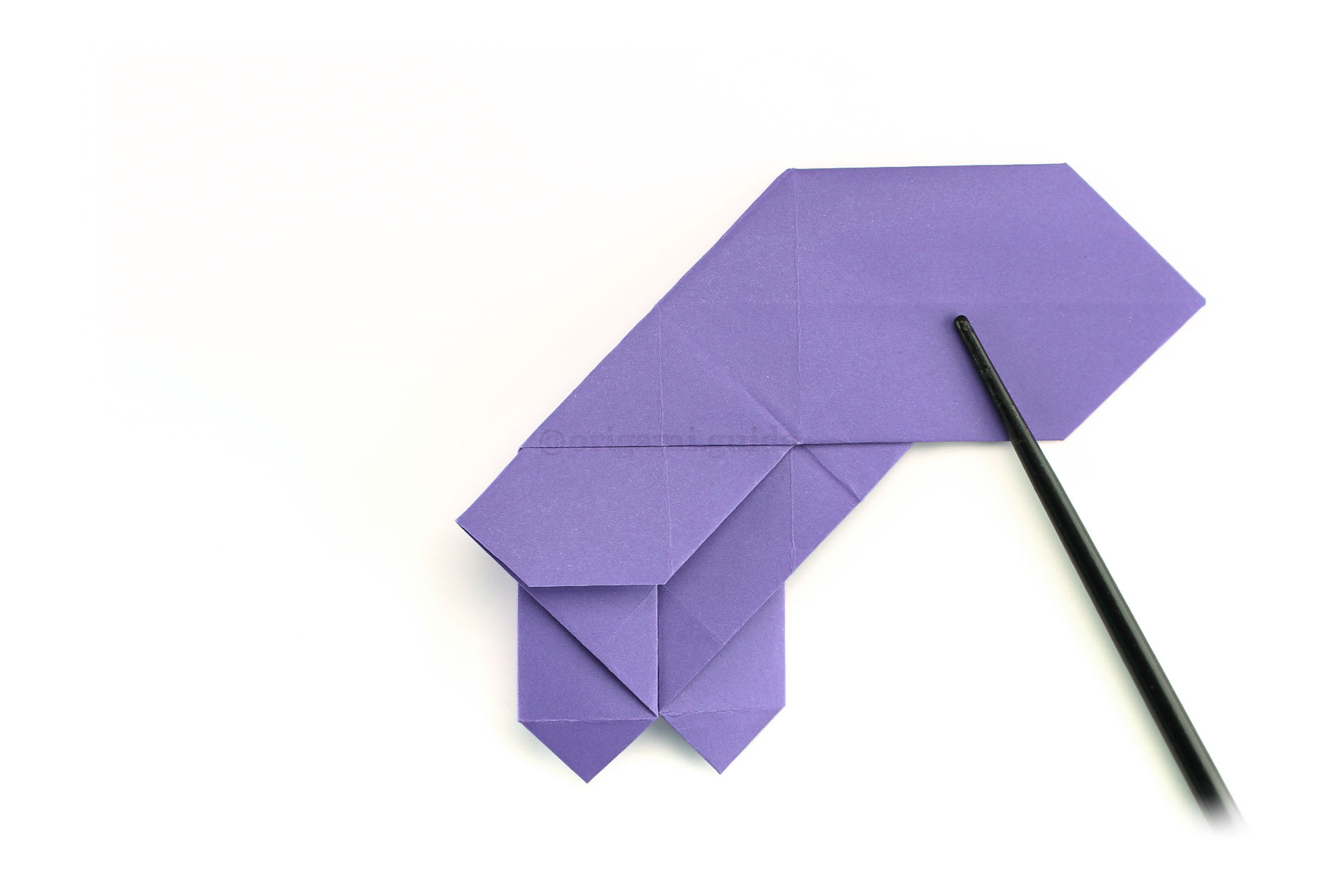 Step 33 - Next we are folding the opposite diagonal crease.